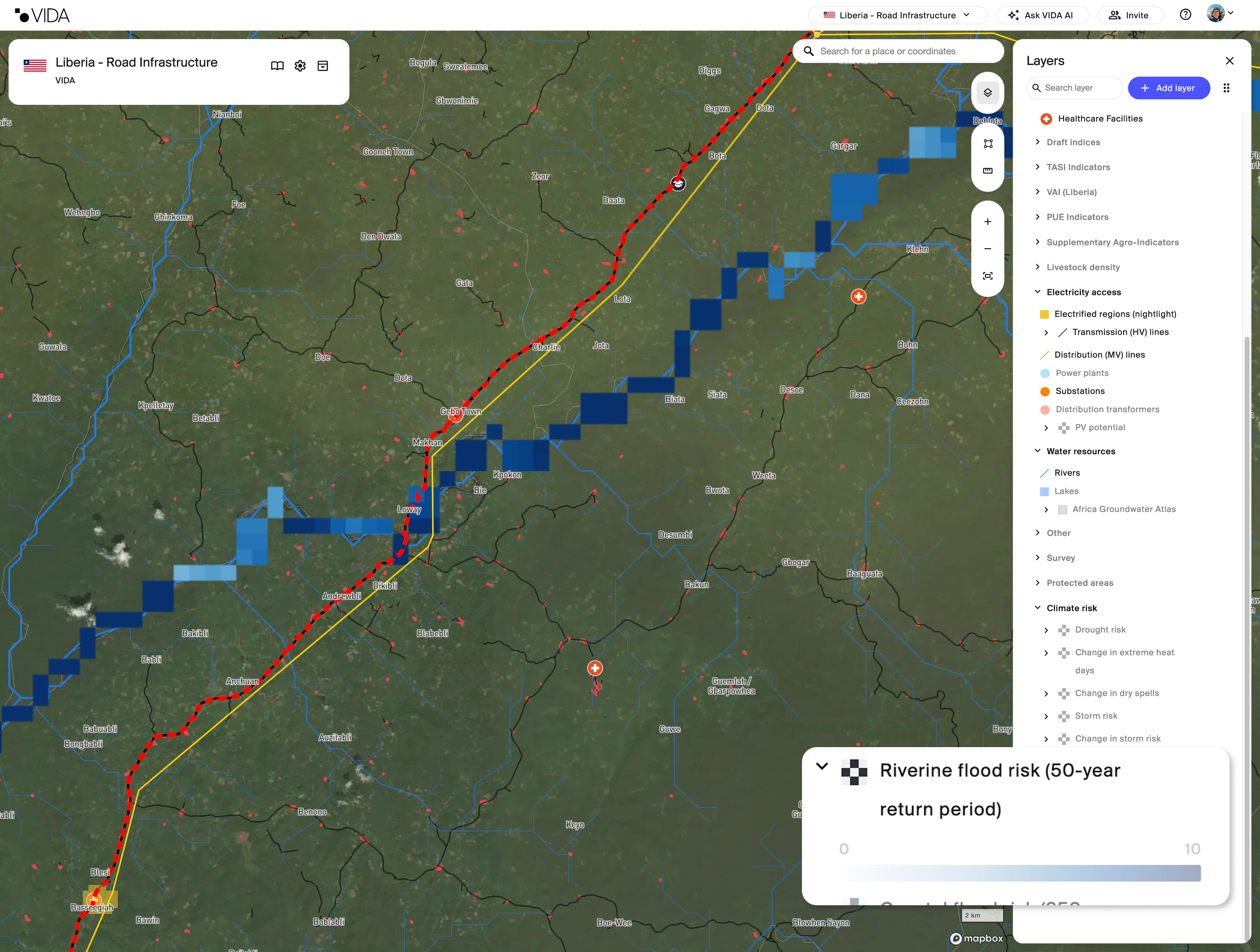 A screenshot of VIDA's geospatial platform with a Riverine flood risk (50-year return period) layer over a road in Liberia.